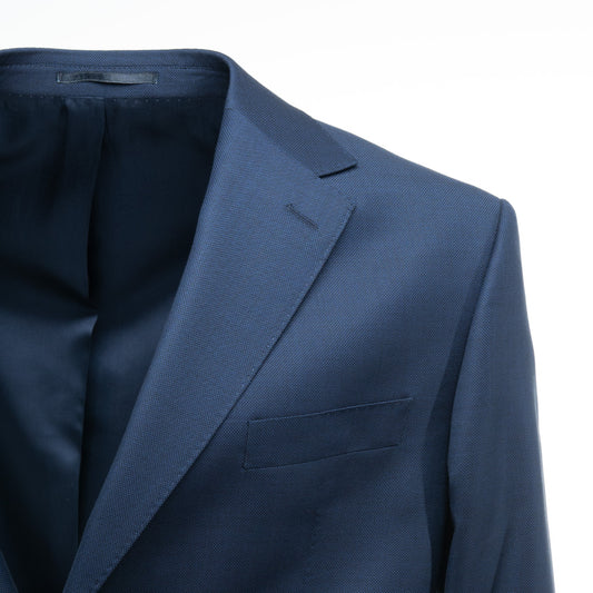 Introducing Bagozza America's Lesina Men's Suit in Parliament Blue (20010) - a stylish, high-quality, classic 2-piece suit that is crafted using the finest 100% Wool Fabric from the Italian Mill F.lli Cerruti. Experience the premium quality and craftsmanship of Bagozza Americas.
