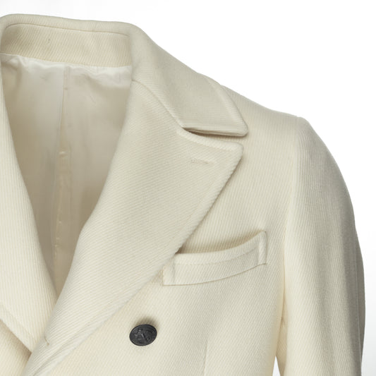 Introducing Bagozza America's Men's Double Breasted Long Coat in Cream with Notched Lapel (4448) - a stylish, high-quality coat that is crafted using the finest wool blend produced by Italian fabric mill Luravi. Experience the premium quality and craftsmanship of Bagozza Americas.